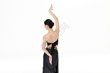 傣族服饰素材跳舞的傣族少女背影背景