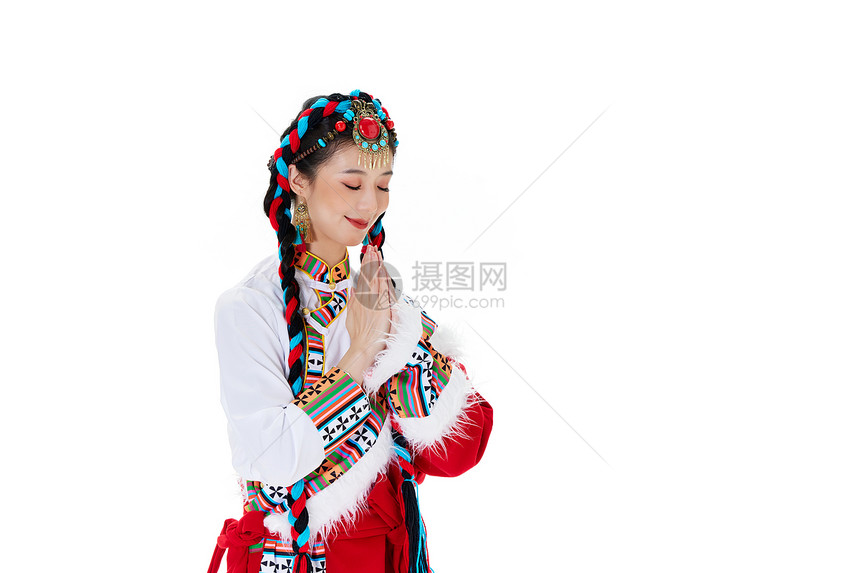 闭眼祈祷许愿的藏族少女图片