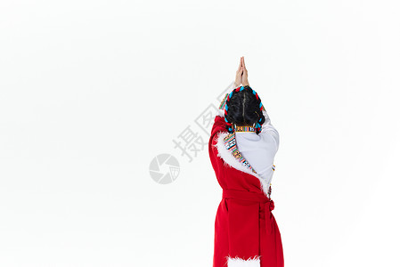 祈祷的藏族女性背影图片