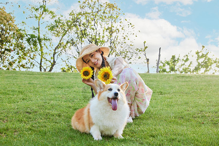 散步狗狗文艺美女和爱宠狗狗向日葵装饰背景