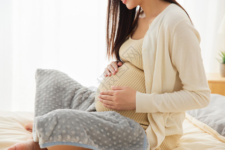 怀孕幸福女人待产孕妇妈妈居家养胎特写背景