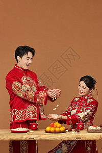 中式婚礼传统接花生背景图片