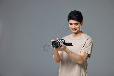 手拿照相机的摄影师形象单反高清图片素材