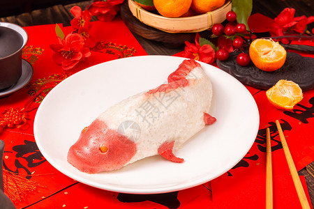 龙年年年有鱼对联春节期间家里的年年有鱼糯米饭背景