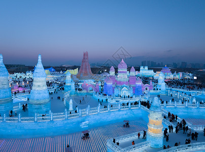 下大雪花素材航拍哈尔滨第二十五届冰雪大世界旅游景点背景