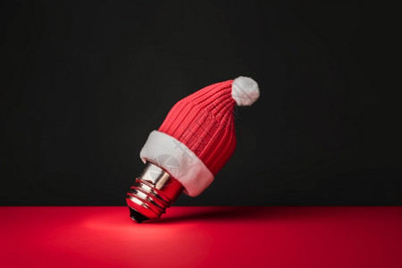 圣诞帽包裹的灯泡背景图片