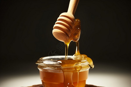 蜂蜜勺子和蜂蜜背景图片
