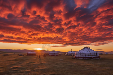 远山落日草原蒙古包背景图片