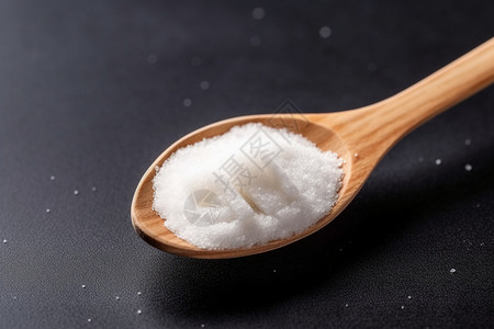 木勺中的白砂糖背景图片