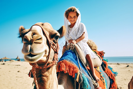 骑骆驼的小女孩背景图片