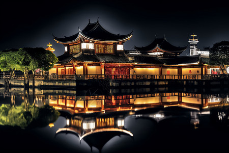 夜晚湖畔的传统建筑背景图片