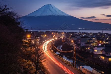 富士山下的城市景观背景图片