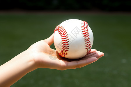 运动员手中的棒球背景图片