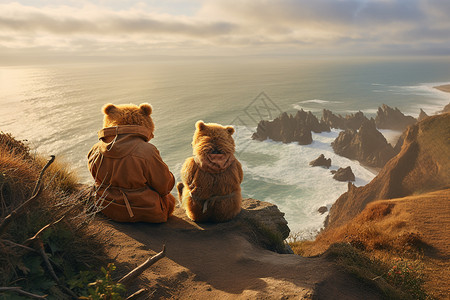 两只熊坐在悬崖边俯瞰海滩图片