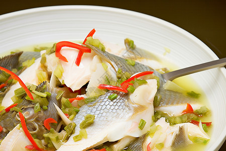 制作酸菜鱼传统美食的酸菜鱼背景