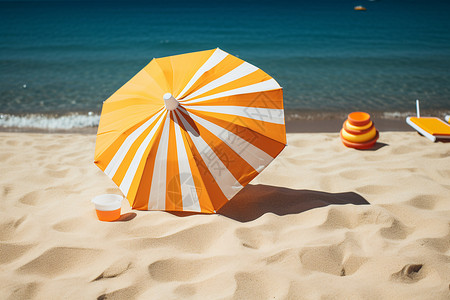 黄橙相交遮阳伞海滩上橙白相间的遮阳伞背景