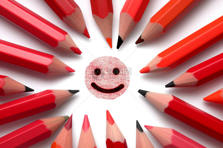 红色铅笔绘画的笑脸图片