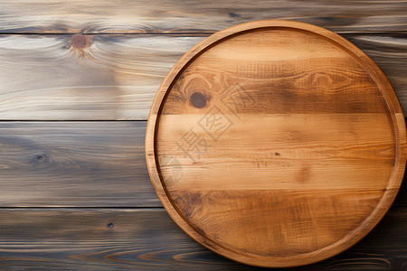 木头菜板木桌上的木盘背景