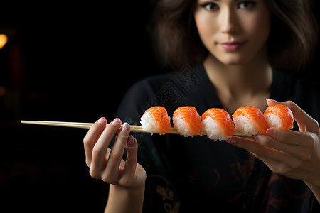 手工制作日式寿司的美女背景图片
