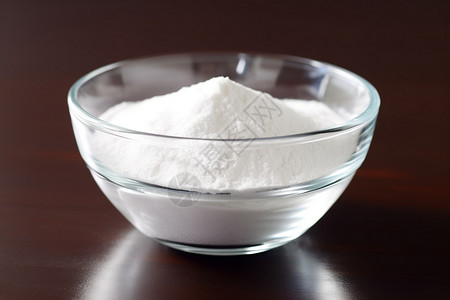 碳酸氢钠白色粉末装在碗中背景
