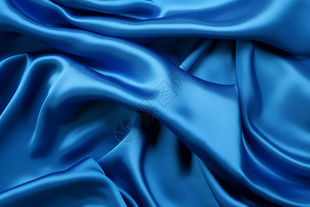 柔软流畅的蓝色丝绸摺叠起来图片