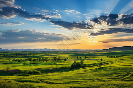 大山与田野夕阳余晖下的田野背景