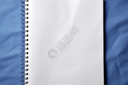 背景素材书籍蓝布上的空白记事本（背景素材-广告传媒）背景