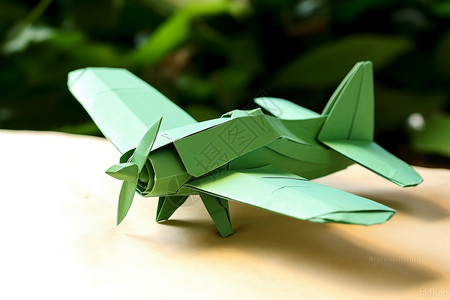 ps纸艺素材绿色的手工折纸飞机背景