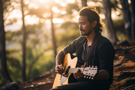 林中弹奏吉他的男人背景图片