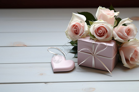 玫瑰下的礼物盒背景图片