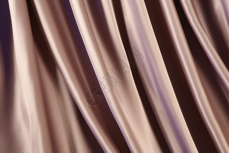 光滑柔软的紫色丝绸布料背景图片