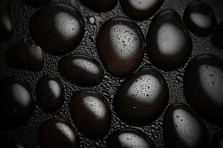 黑色皮革上面的水滴背景图片