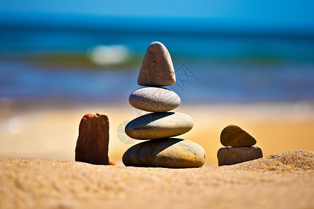 沙滩上平衡的鹅卵石背景图片