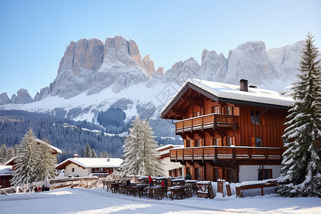 冬季雪山小屋建筑的美丽景观背景图片