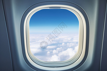 客机窗户飞翔于云端的飞机背景