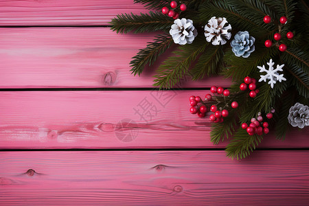 粉色木质背景上的圣诞树枝背景图片