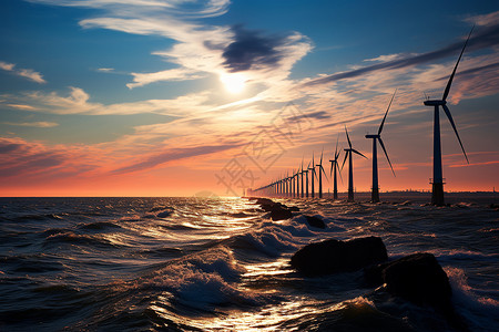 日落时一排风力机背景图片