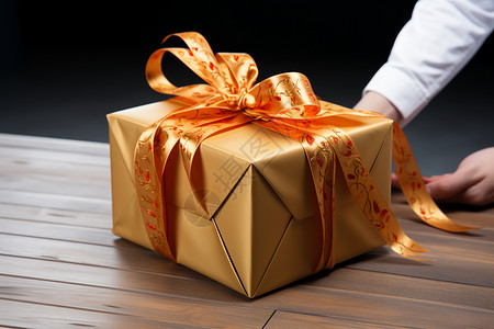 桌面上金色的礼盒背景图片