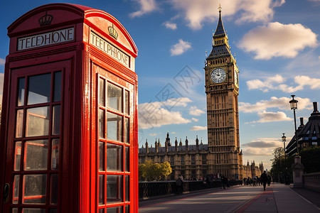 红色电话亭与高耸的钟楼背景图片