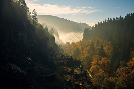 山峦云雾缭绕的山谷景观高清图片
