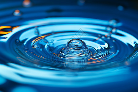 水中的蓝色水滴背景图片