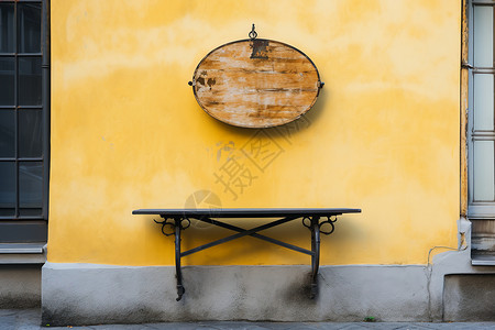 黄色墙壁背景黄色建筑旁的木质招牌背景