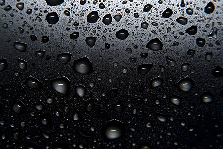 水滴黑色黑色背景上的水滴特写纹理设计图片