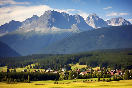 山脉下的村庄背景图片