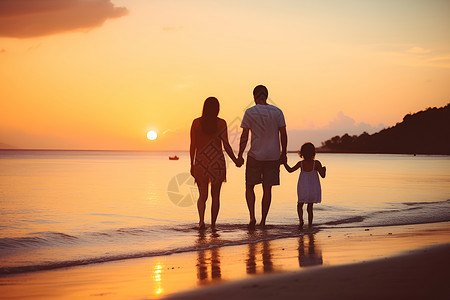 傍晚沙滩漫步的一家人背景图片