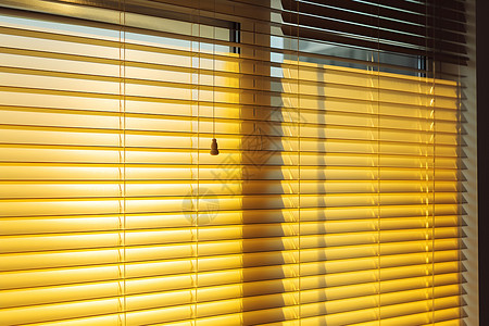 阳光洒进窗户室内家居的百叶窗背景