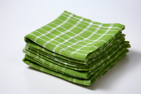绿色亚麻布堆叠的绿色桌布背景