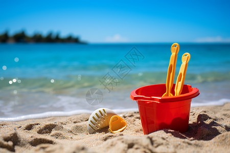 沙滩儿童沙玩具沙滩上的玩具桶背景