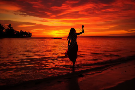 夏季日落海滩上的美丽女子背景图片