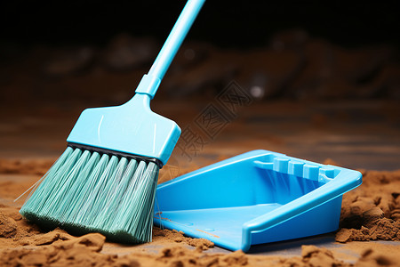 尘土之城塑料扫帚和蓝色的垃圾铲背景